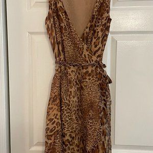 Animal print wrap dress, plunge neckline ruffled hem.
